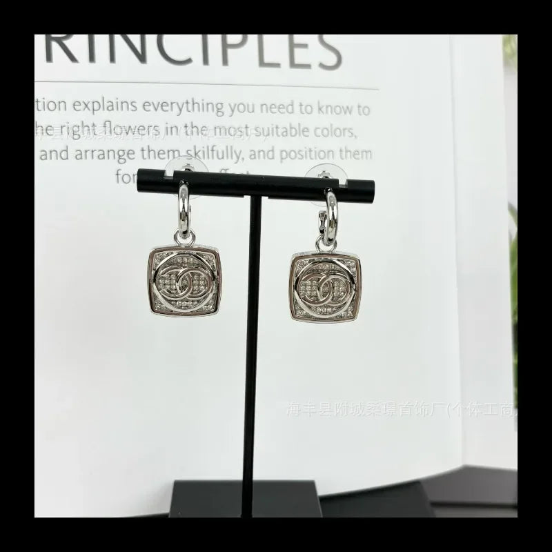 Small Sphere Shape Fashionable Round Ball with Square Diamond Letter Stud Earrings Gold-plated Material