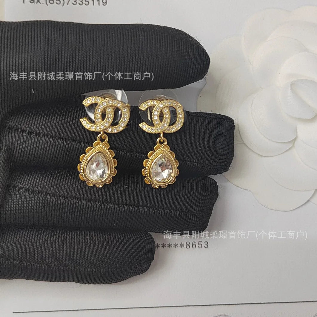 Small Sphere Shape Fashionable Round Ball with Square Diamond Letter Stud Earrings Gold-plated Material